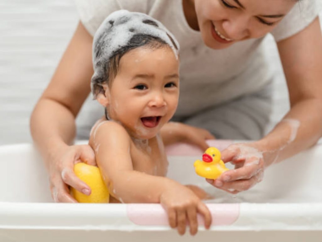 Baby using gentle wash for sensitive skin