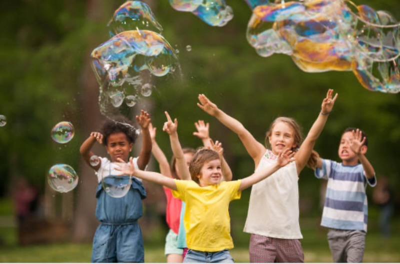 Kids Playing and laughing in a park