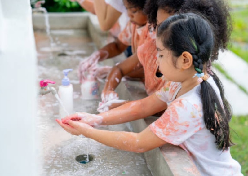 Kids washing hands after play